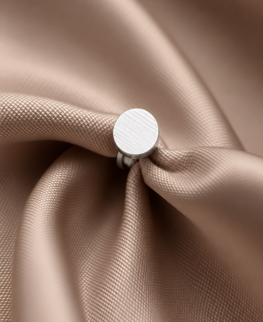 Petit Signet — A hand-engraved oval signet face in warm rose gold, ready to monogram.