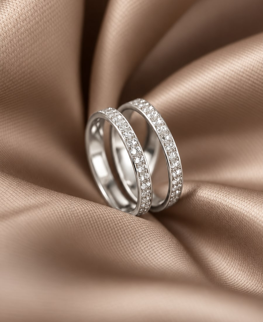 Duo Stack — Two interlocking bands in mixed metals, with bezel-set round accents.